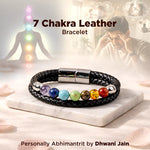 7 Chakra Leather Bracelet with colorful beads on a marble surface, with people practicing yoga in the background.