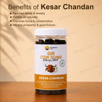 A bottle Kesar Chandan Gir Cow Dung Dhoop Stick placed on a wooden surface against a beige background with text detailing the benefits of Kesar Chandan.