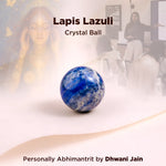 Lapis Lazuli crystal ball with blurred people in a room in the background