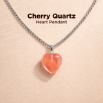 Cherry Quartz heart pendant necklace on a beige background