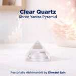 Clear Quartz Shree Yantra Pyramid on a white surface with soft lighting