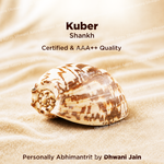 Shell on sand with 'Kuber Shankh' text and branding