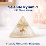 Selenite pyramid with Shree Yantra on a blurred background