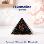 Tourmaline pyramid with spiral design on a white background, branded by Dhwani Jain.