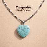 Turquoise heart pendant necklace on a beige background