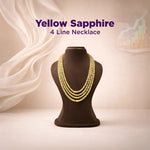 Yellow sapphire 4 line necklace on a mannequin bust with a soft background