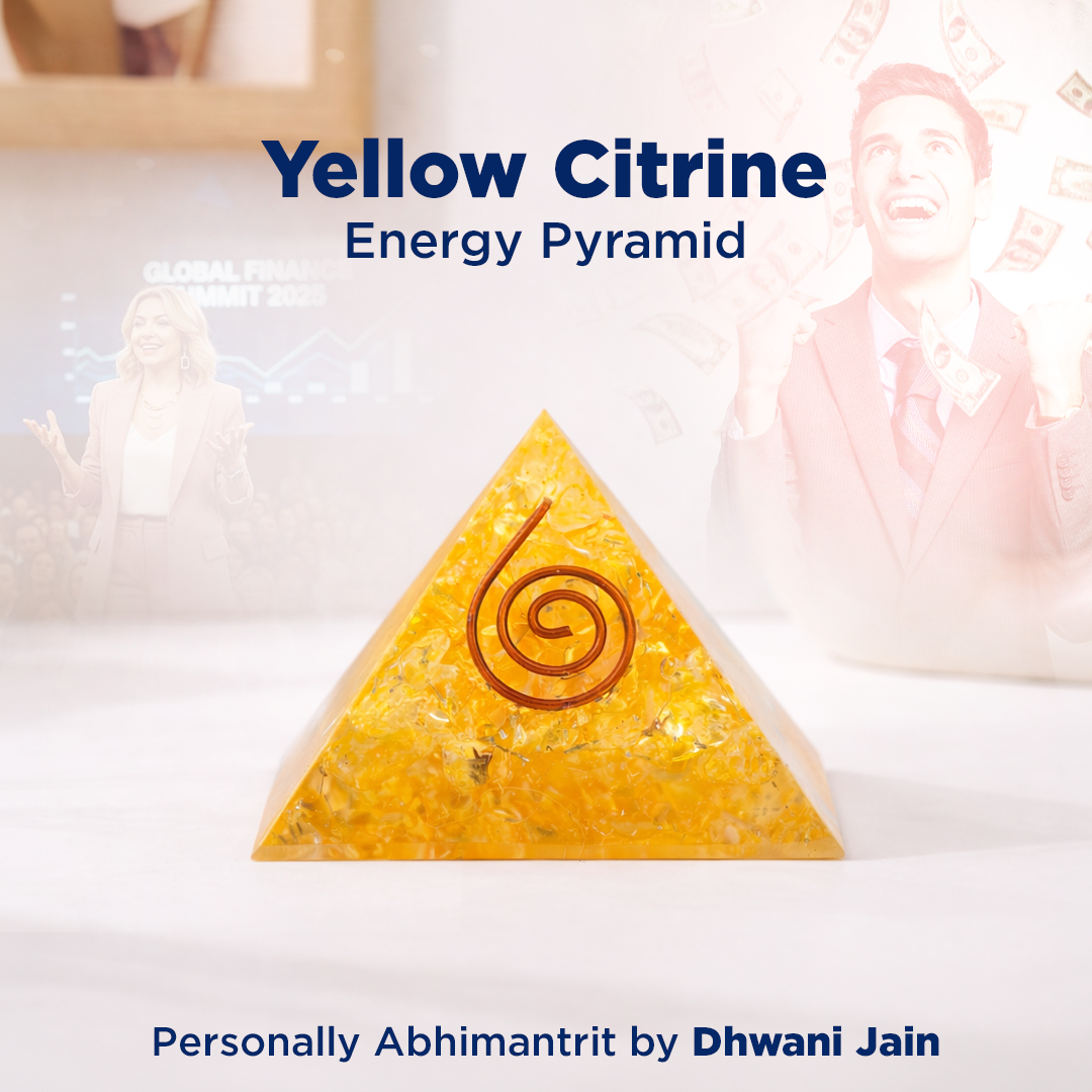 Yellow Citrine energy pyramid with a spiral design on a blurred background