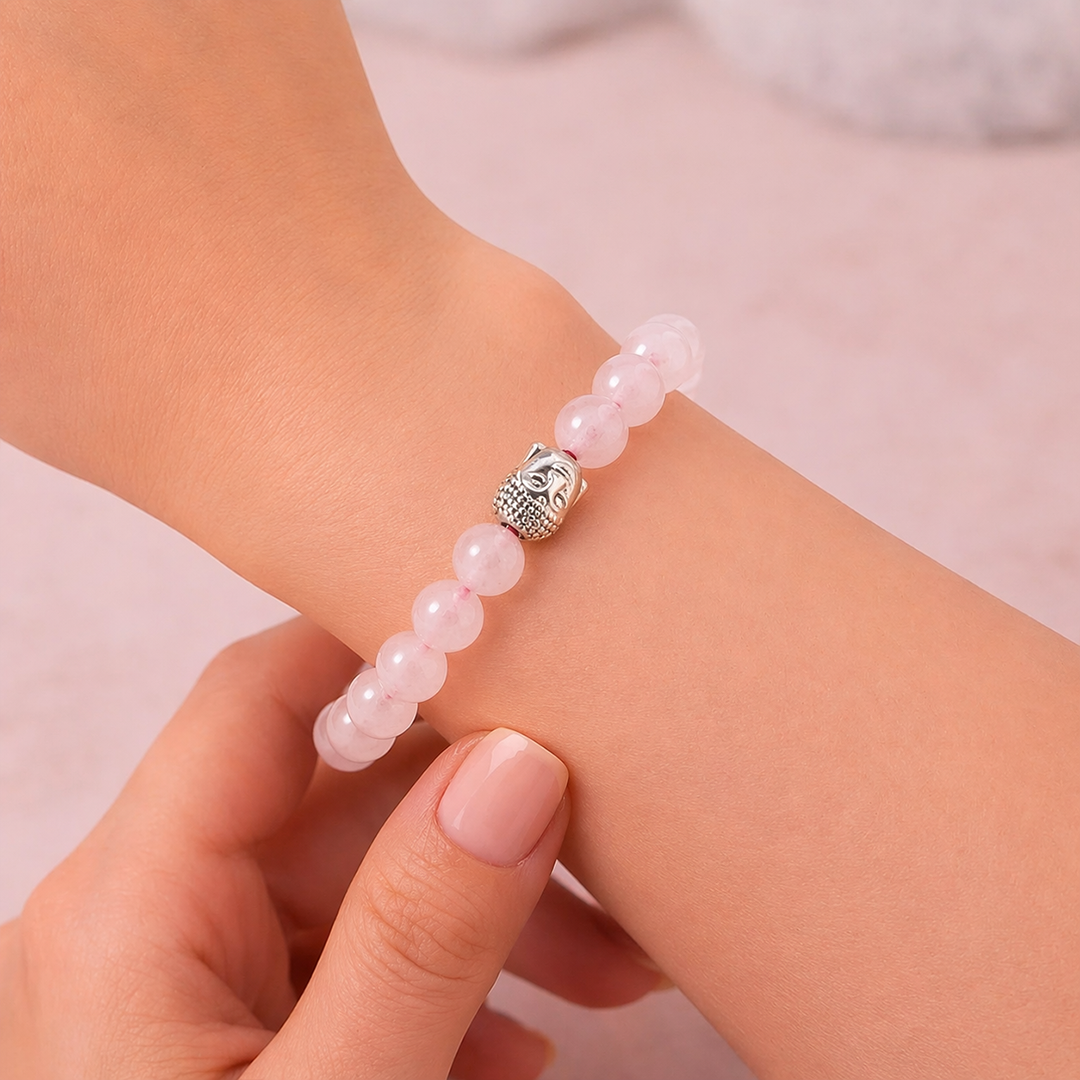 Pink beaded bracelet with a silver owl charm on a wrist against a light backgroundRose Quartz Bracelet for Love Relationship Healing Self Love