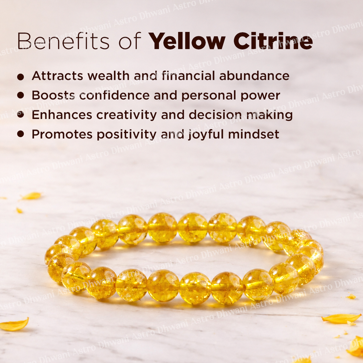 Yellow crystal bracelet with benefits listed on a light background