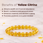 Yellow crystal bracelet with benefits listed on a light background