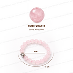 Rose quartz bracelet with a single rose quartz bead on a white background