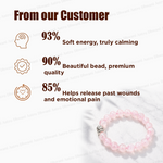 Pink beaded bracelet with customer feedback on a light background