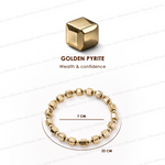 Gold bracelet with a cube-shaped Golden Pyrite stone on a white background