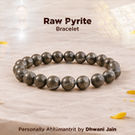 Raw pyrite bracelet on a textured surface with 'Dhwani Jain' branding.