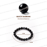Black Sulemani bracelet with a large black bead on a white background