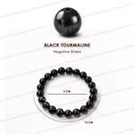 Black tourmaline bead and bracelet on a white background with text indicating 'Negative Shield'.