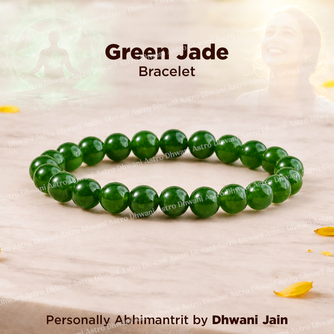 Green jade bracelet on a light wooden surface with 'Dhwani Jain' branding.