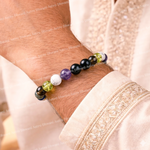 Multicolored beaded bracelet on a wrist with a light background