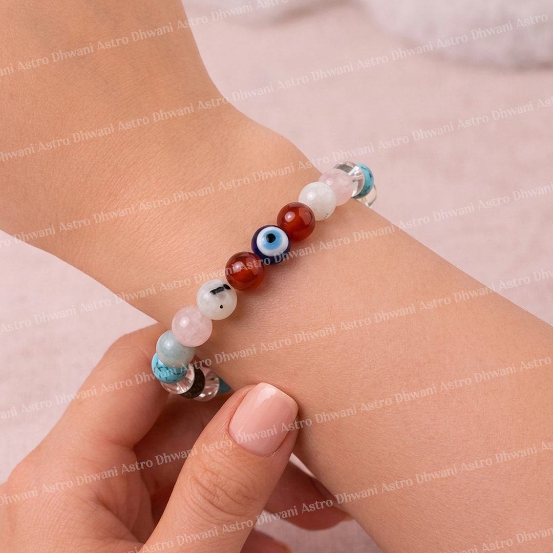 Close-up of a hand wearing a colorful beaded bracelet on a light pink background.