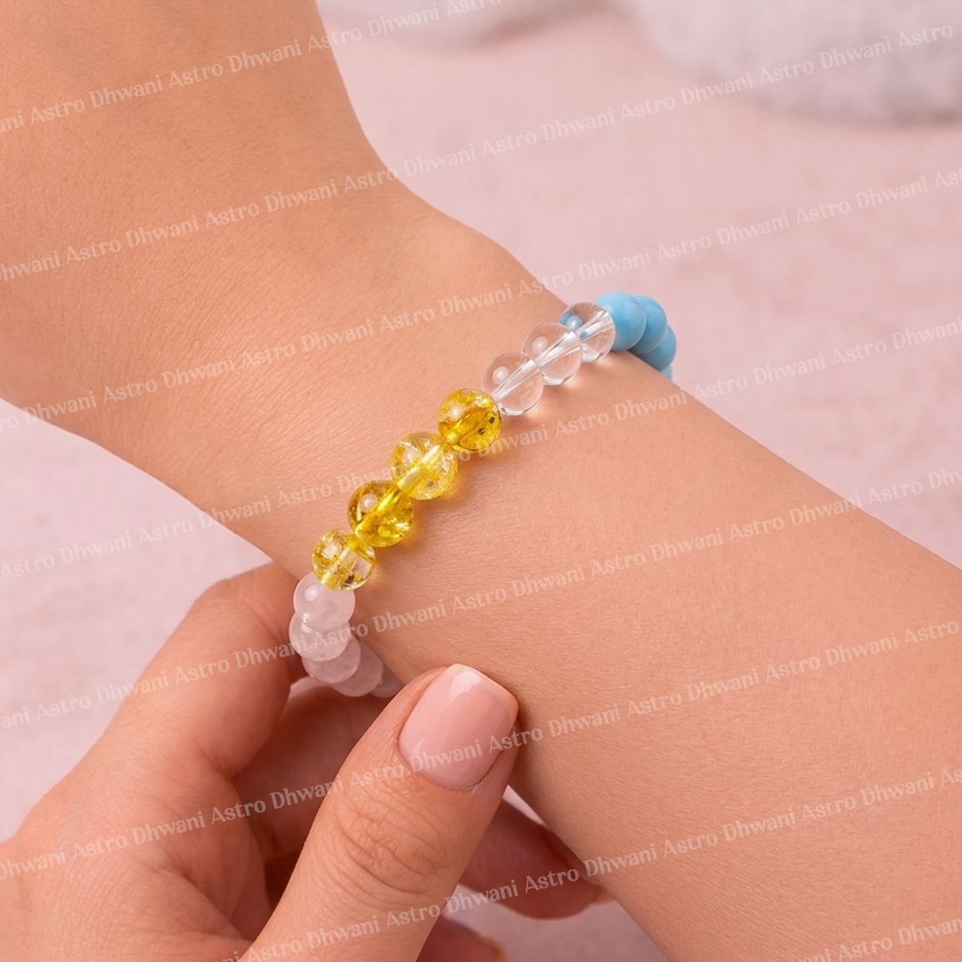 Close-up of a hand wearing a colorful beaded bracelet on a light pink background