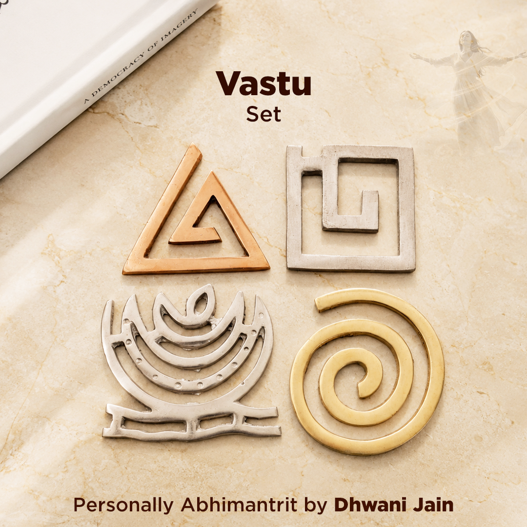 Four metallic Vastu symbols arranged on a beige stone-textured surface with text reading 'Vastu Set'