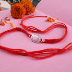 Vedic-inspired 925 Sterling Silver Shiv Rakhi with handcrafted red thread and premium festive presentation for brothers.
