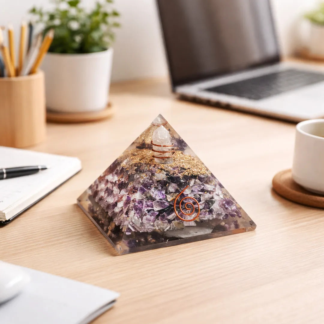 Crystal pyramid on a desk with laptop, notebook, and cup in the backgroundAmethyst Crystal Pyramid – Natural Healing Crystal Pyramid for Calm, Meditation
