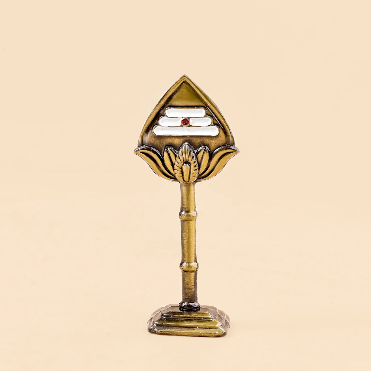 Decorative object with a triangular top and cylindrical base on a beige background
