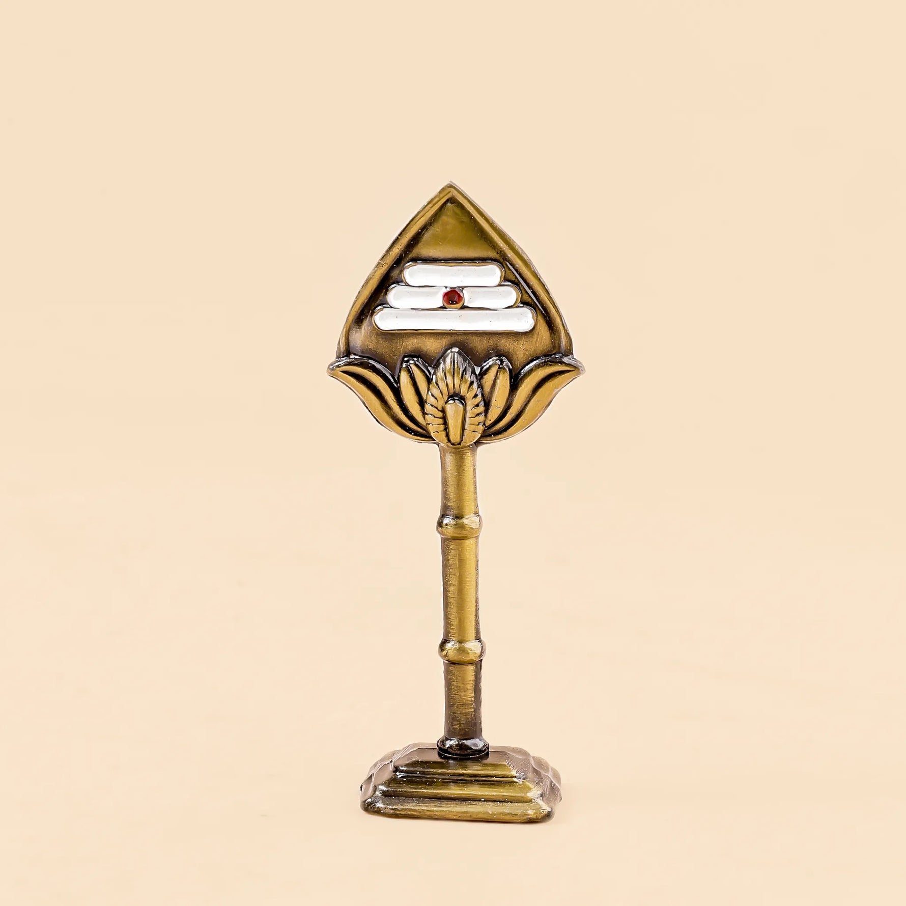 Decorative object with a triangular top and cylindrical base on a beige backgroundMurugan Vel – Divine Protection & Victory Symbol | Abhimantrit & Certified