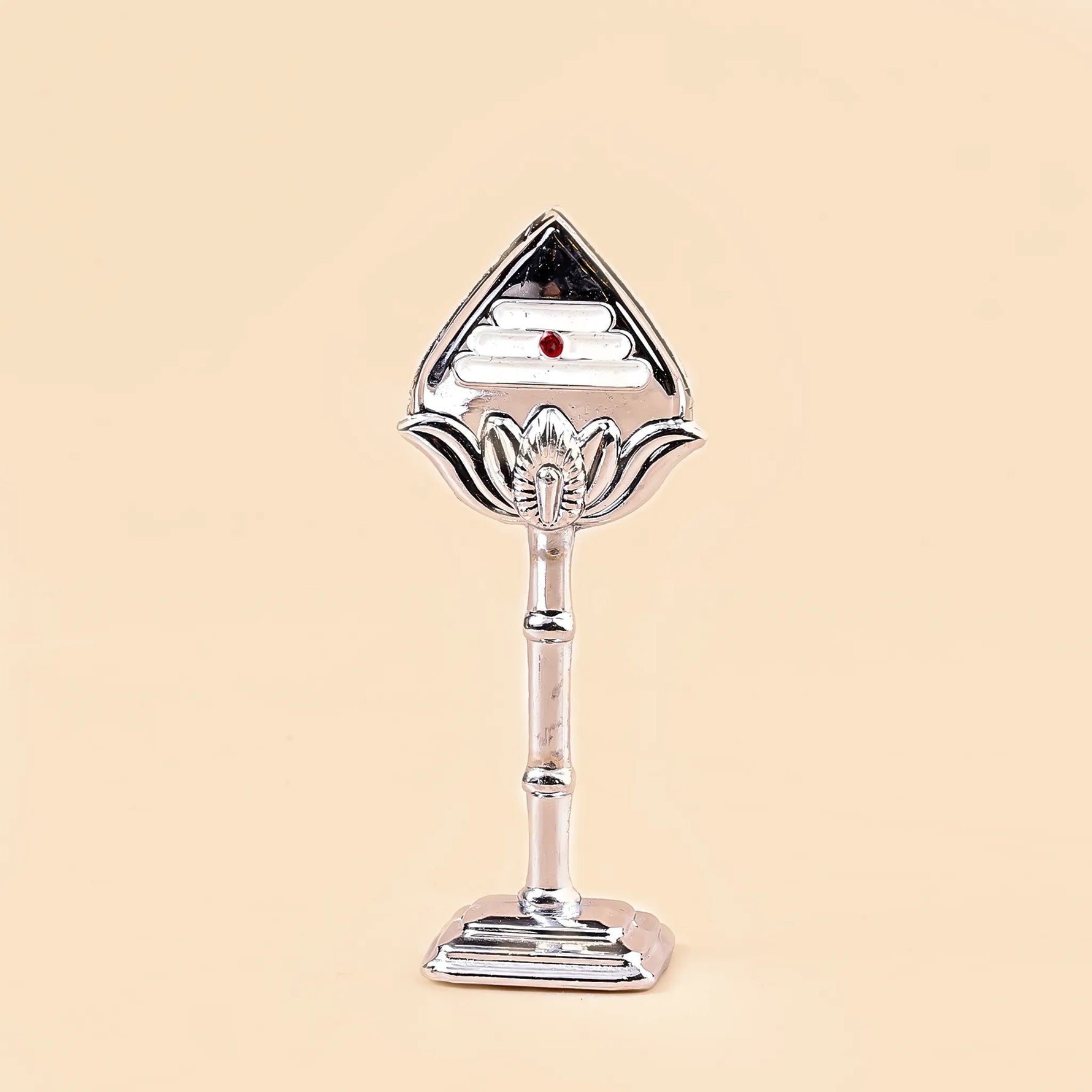 Decorative silver object with a red gemstone on a beige backgroundMurugan Vel – Divine Protection & Victory Symbol | Abhimantrit & Certified
