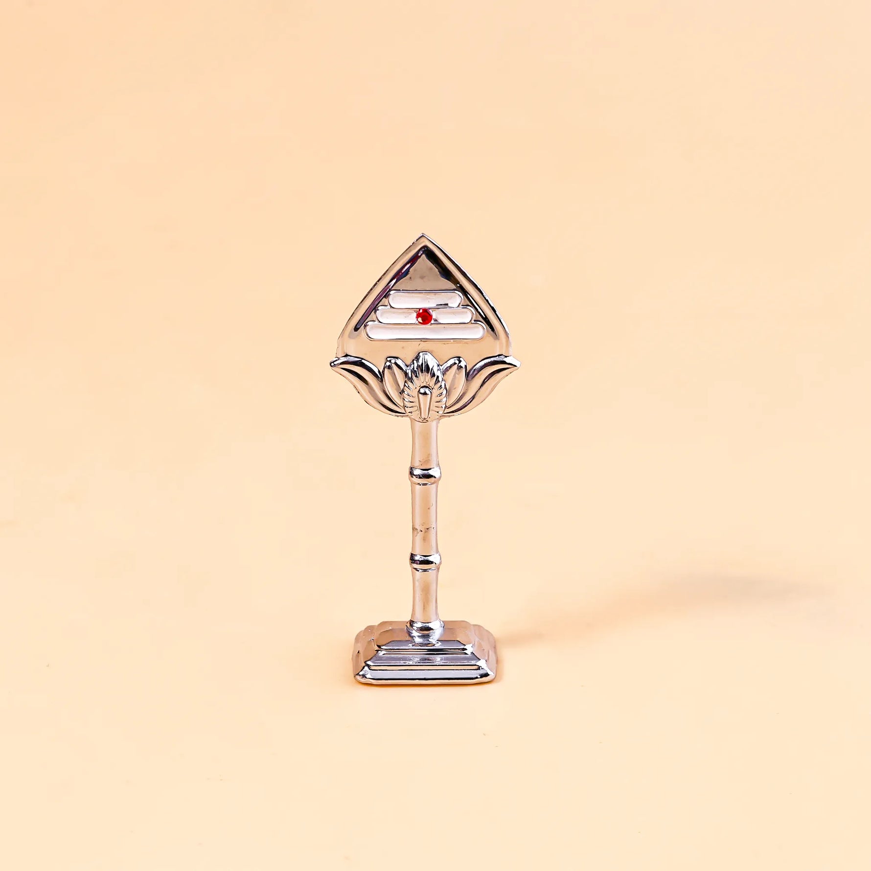 Decorative object with a triangular top and cylindrical base on a beige backgroundMurugan Vel – Divine Protection & Victory Symbol | Abhimantrit & Certified