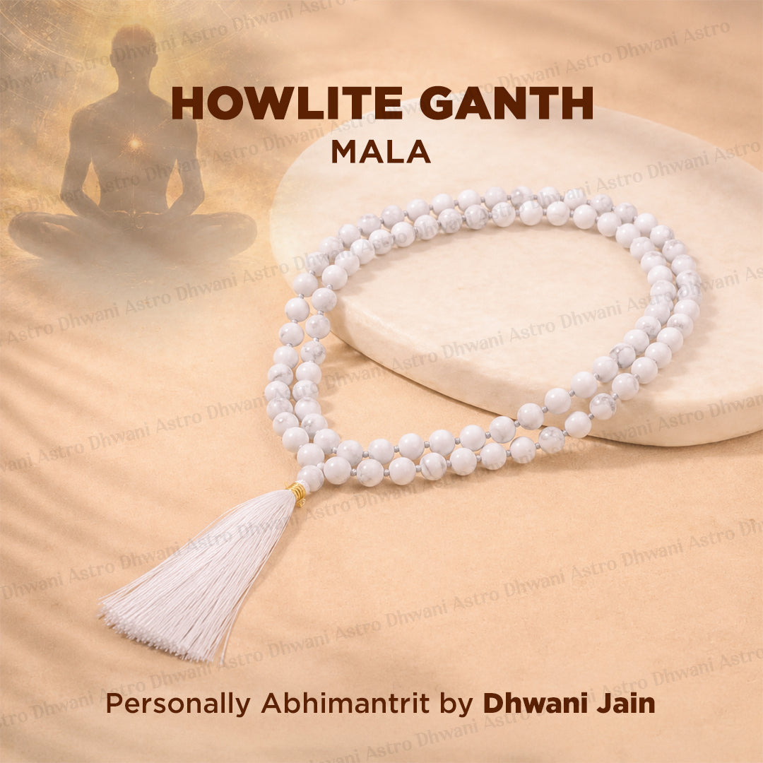 Howlite crystal necklace with a white tassel is displayed on a beige fabric background with a stone slab prop. The image features text overlays reading 'HOWLITE GANTH MALA'