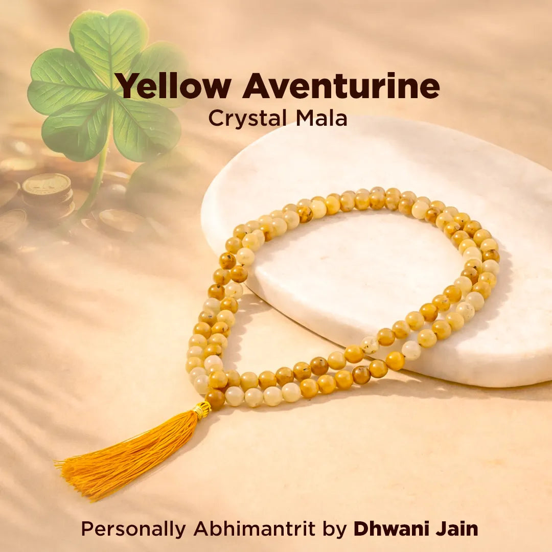 Yellow aventurine crystal mala with tassel on a beige background