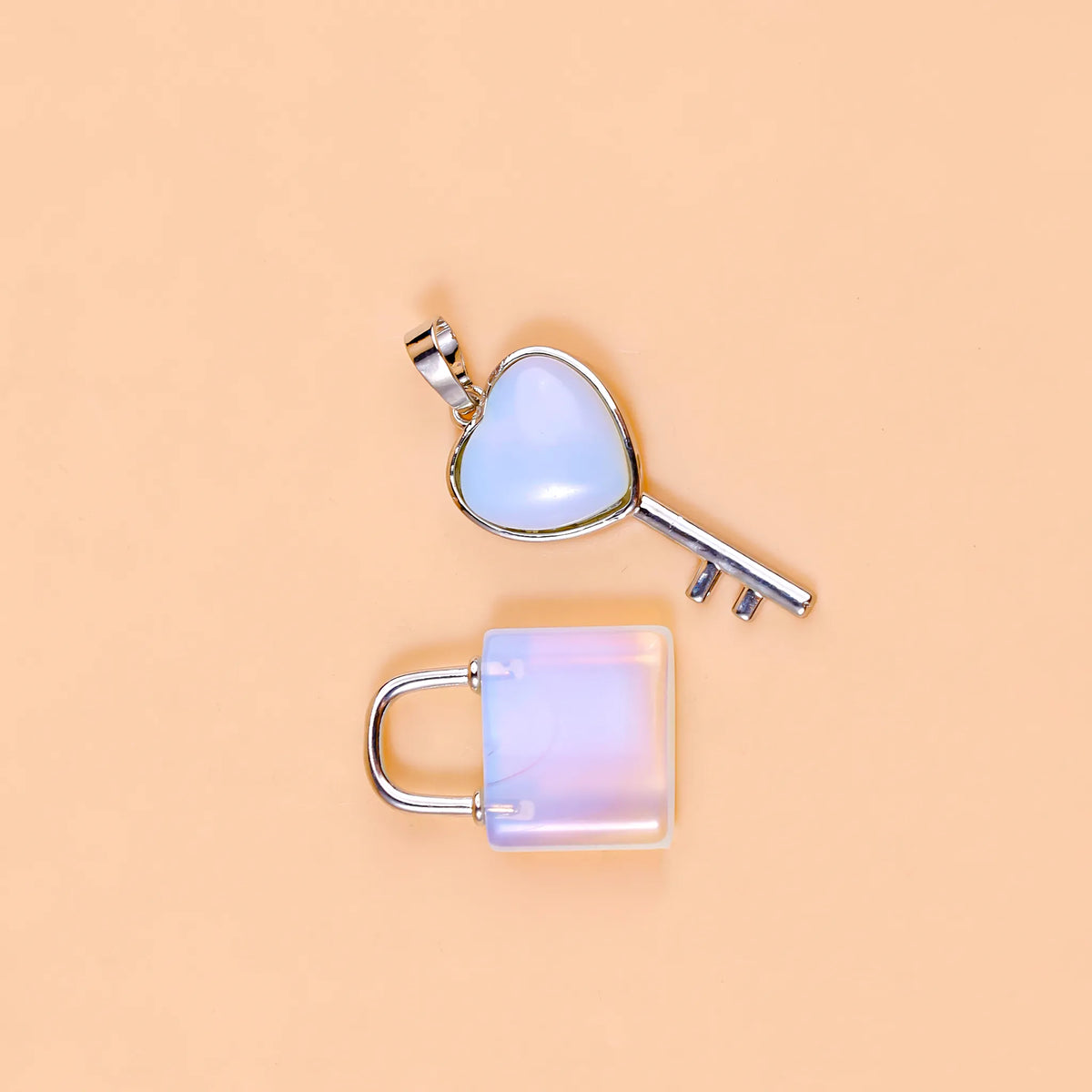 Heart-shaped key and lock pendant on a beige background