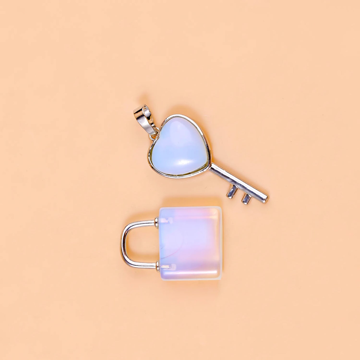 Heart-shaped key and lock pendant on a beige background