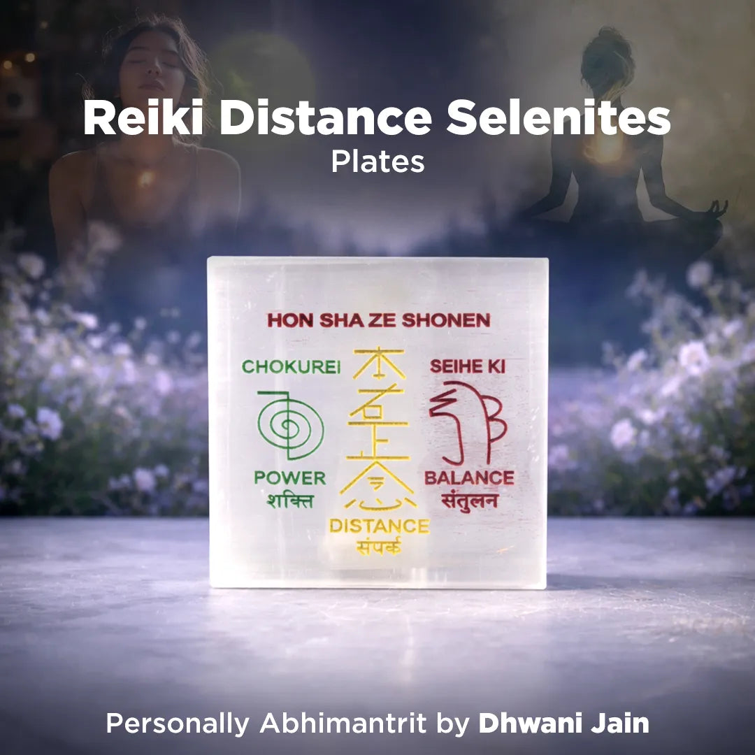 Reiki Distance Selenites plates with symbols and text on a blurred natural background