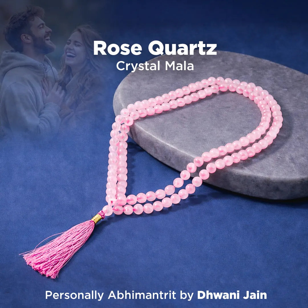 Rose Quartz Crystal Mala necklace on a dark blue background with a couple in the background.