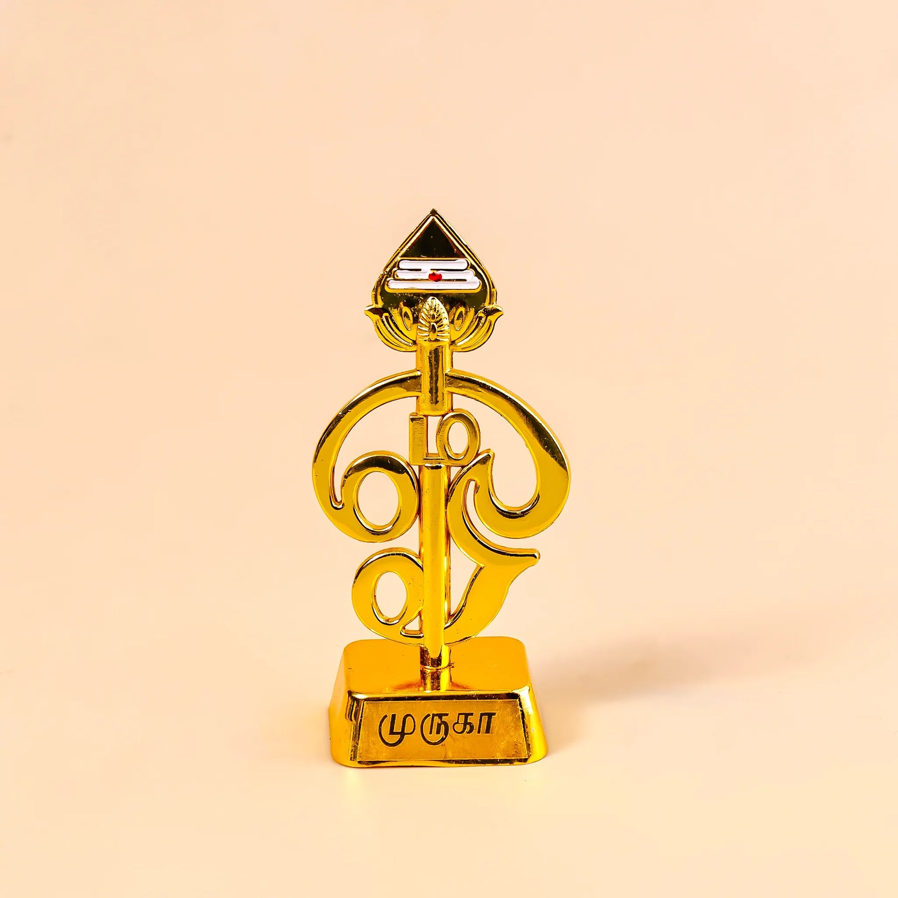 Gold decorative item with intricate design on a beige backgroundOm Vel – Divine Protection Symbol | Abhimantrit & Certified
