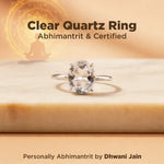 Clear Quartz Ring on a wooden surface with a blurred background