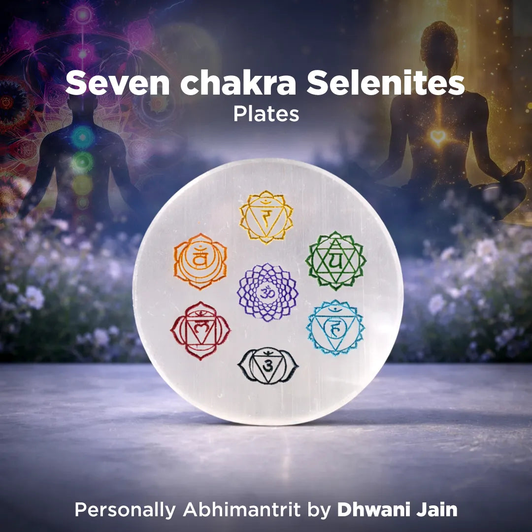 Seven chakra Selenites plates with a blurred background of people and nature.