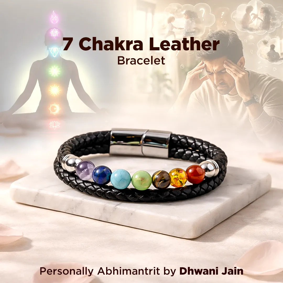 7 Chakra Leather Bracelet with colorful beads on a marble surface, with people practicing yoga in the background.