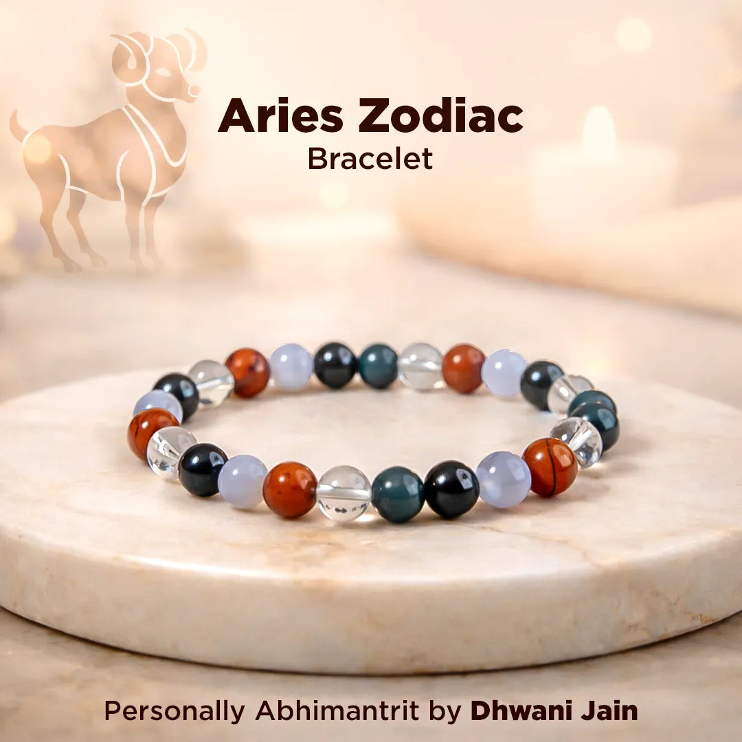 Aries Zodiac bracelet with colorful beads on a marble surface, featuring the Aries symbol.