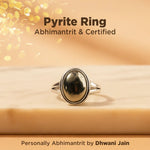 Pyrite ring on a wooden surface with text about certification and branding.