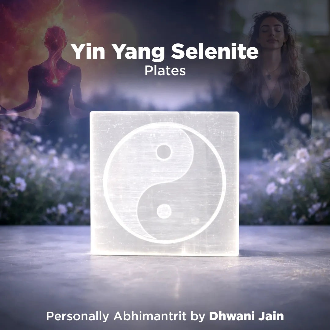 Yin Yang Selenite plates with two people in a field in the background