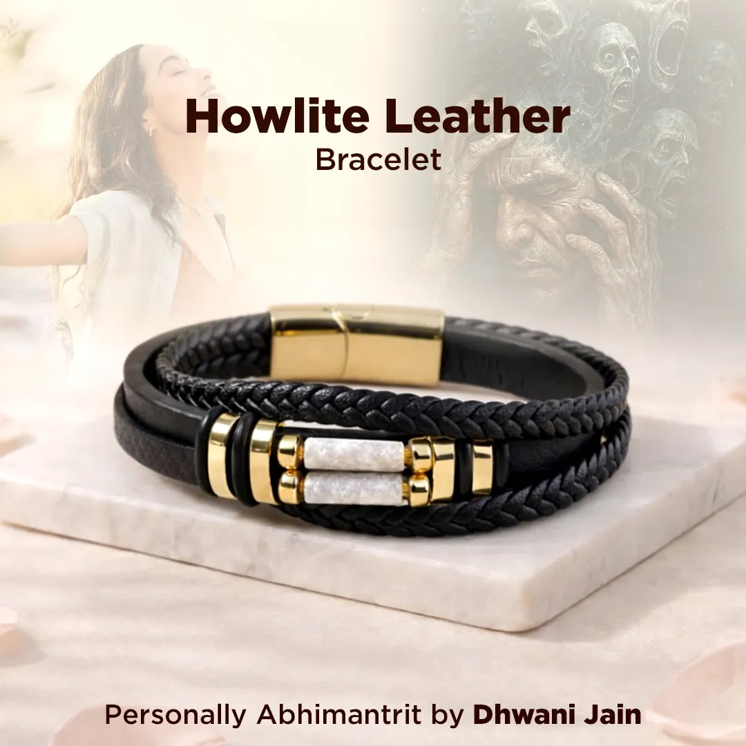 Black leather bracelet with gold accents on a marble surface, labeled 'Howlite Leather Bracelet' by Dhwani Jain.