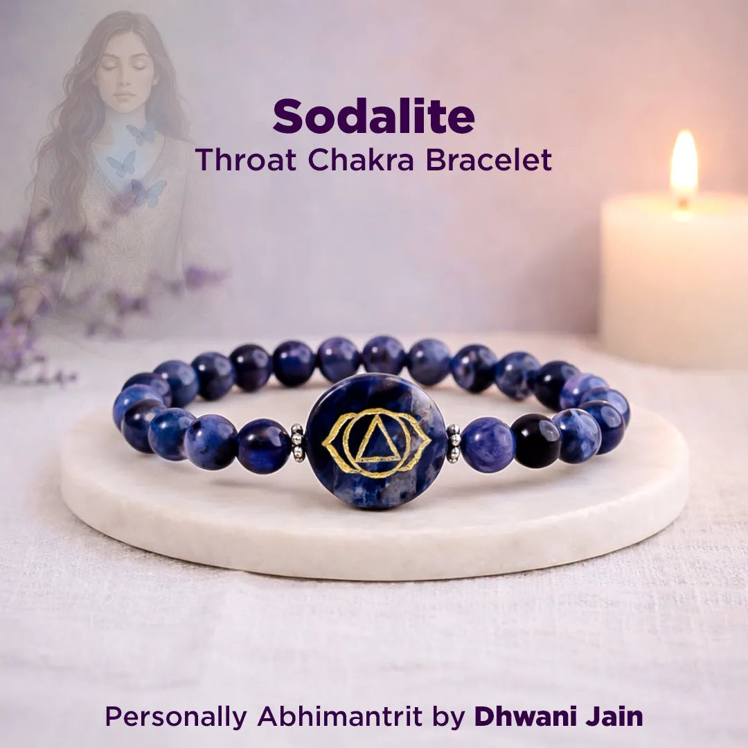 Sodalite Throat Chakra bracelet on a white surface with a blurred background