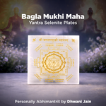 Selenite plates with Yantra design on a white background, surrounded by blurred figures and nature.