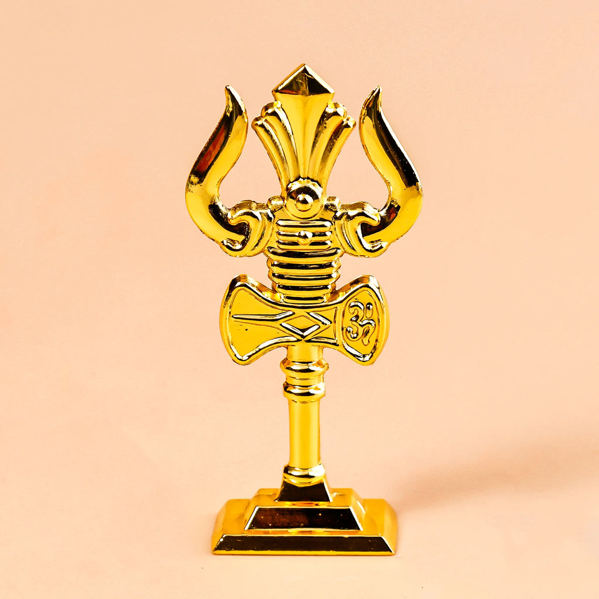 Gold astrological symbol on a beige background