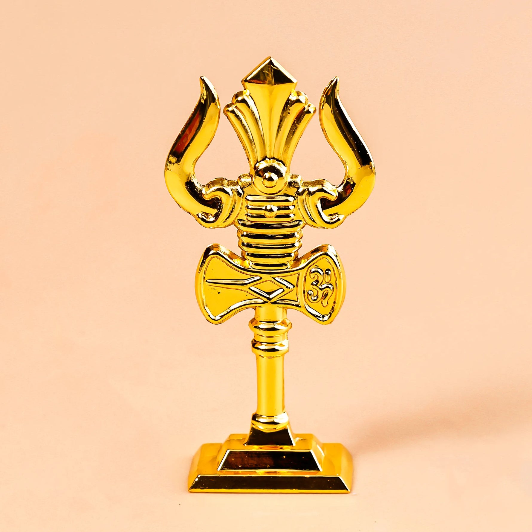 Gold astrological symbol on a beige background