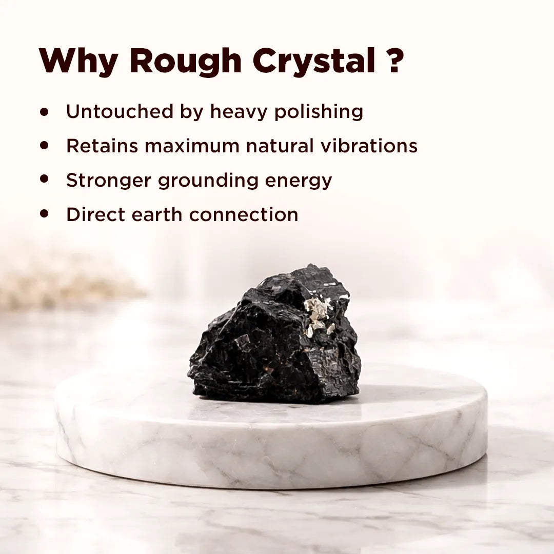 Rough crystal on a marble stand with text explaining benefits of using rough crystals.